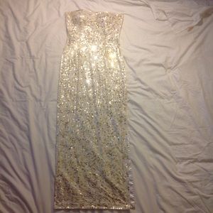 White sequined strapless stretch gown with slit